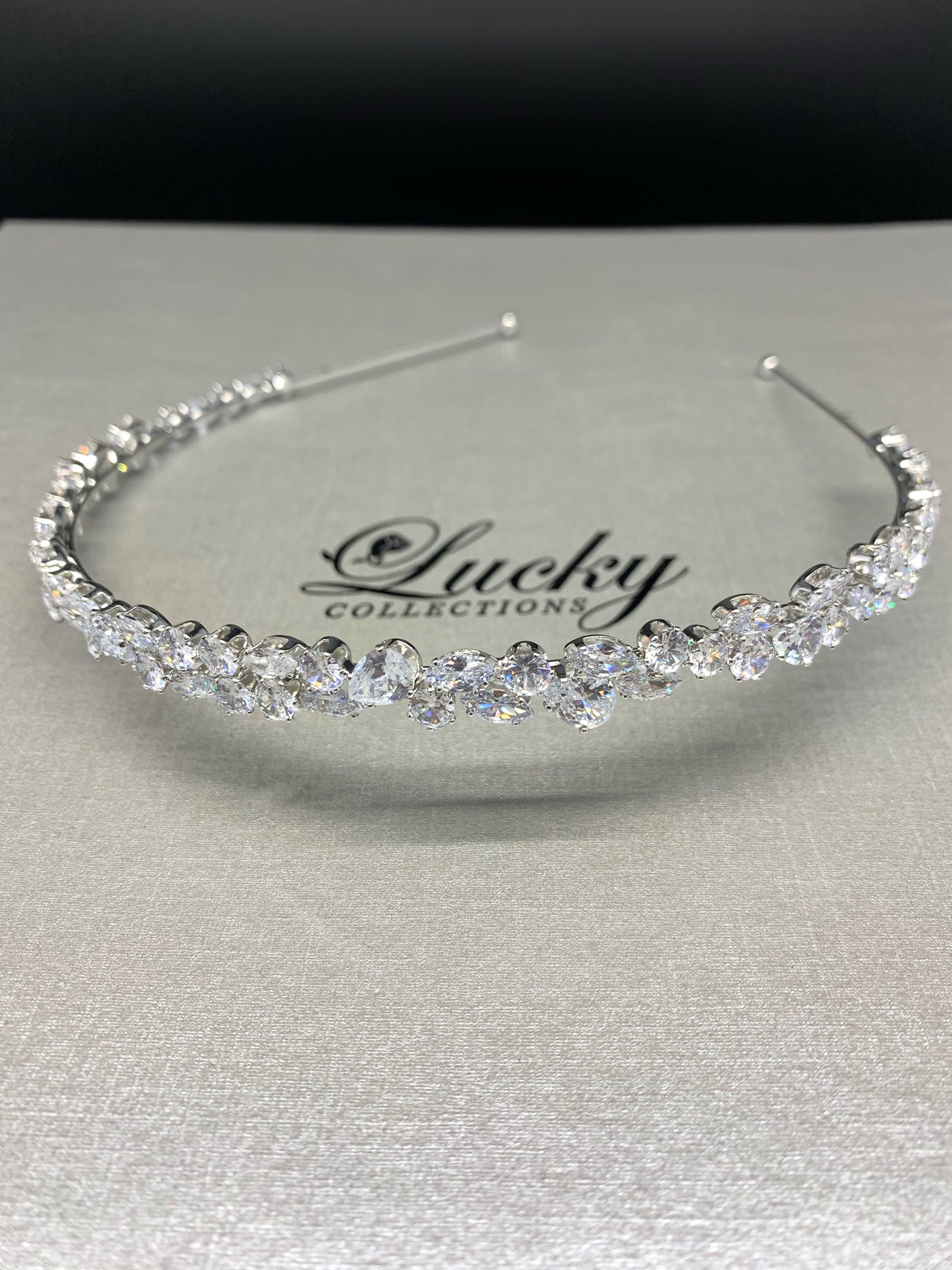 Bridal  Headband will keep hair off so your face becomes the focal point of your beauty.  1/4 inch wide Headband with Quality cut AAA Teardrop, Round &  Marquise Zirconia . Lucky Collections ™ 934 Maple Ave  Los Angeles, Ca 90015